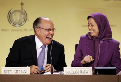 Rudy Giulani (L), former mayor of New-York city, shares a laugh with the president of the National Council of Resistance of Iran Maryam Rajavi (R) on January 20, 2012 in Paris, during an international conference regarding a solution for Camp Ashraf in Iraq, which is home to thousands of outlawed Iranian regime opponents. Camp Ashraf has become a mounting problem for the Iraqi authorities since US forces transferred security for the camp in January 2009, and amid pressure from Tehran to hand over the members of the militant group. The Iraqi government says the camp is a threat to its relations with neighboring Iran and is demanding that it close by December 31, 2011. But the United Nations appealed at the end of 2011 for an extension to the deadline to allow more time in negotiations with the camp's residents, who are refusing to move unless they are given UN protection.   JACQUES DEMARTHON / AFP PHOTO (Photo credit should read JACQUES DEMARTHON/AFP/Getty Images)